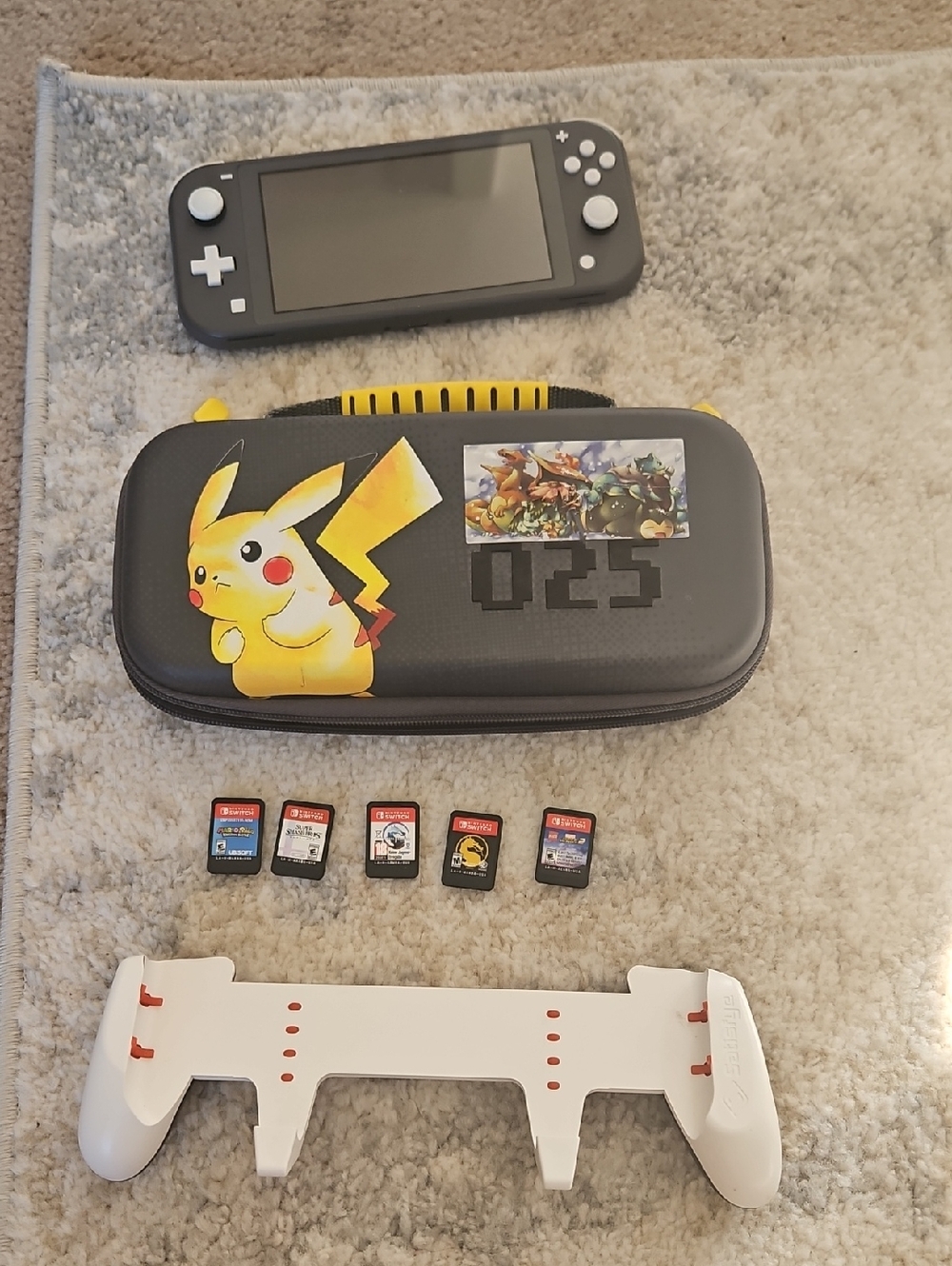 Gray Nintendo Switch Lite With Carry Case and Five Games And Extender